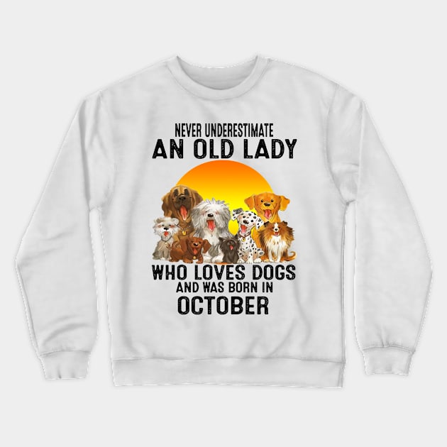 Never Underestimate An Old October Lady Who Loves Dogs Crewneck Sweatshirt by trainerunderline